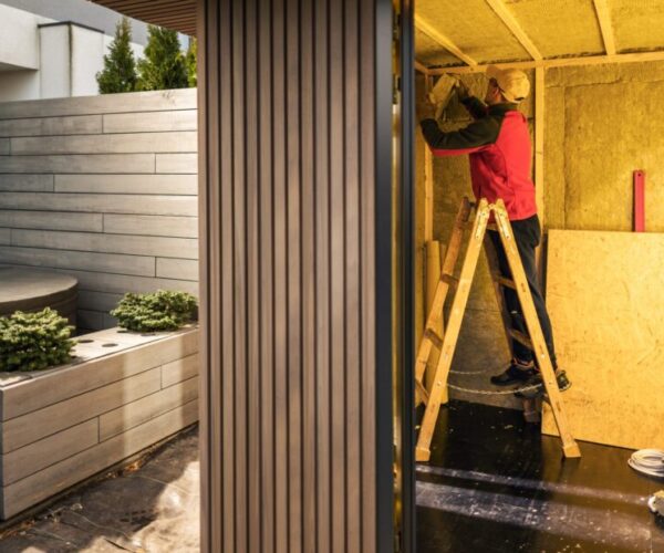 man-insulating-newly-built-garden-shed-with-minera-2023-11-27-05-20-15-utc-scaled man-insulating-newly-built-garden-shed-with-minera-2023-11-27-05-20-15-utc-scaled