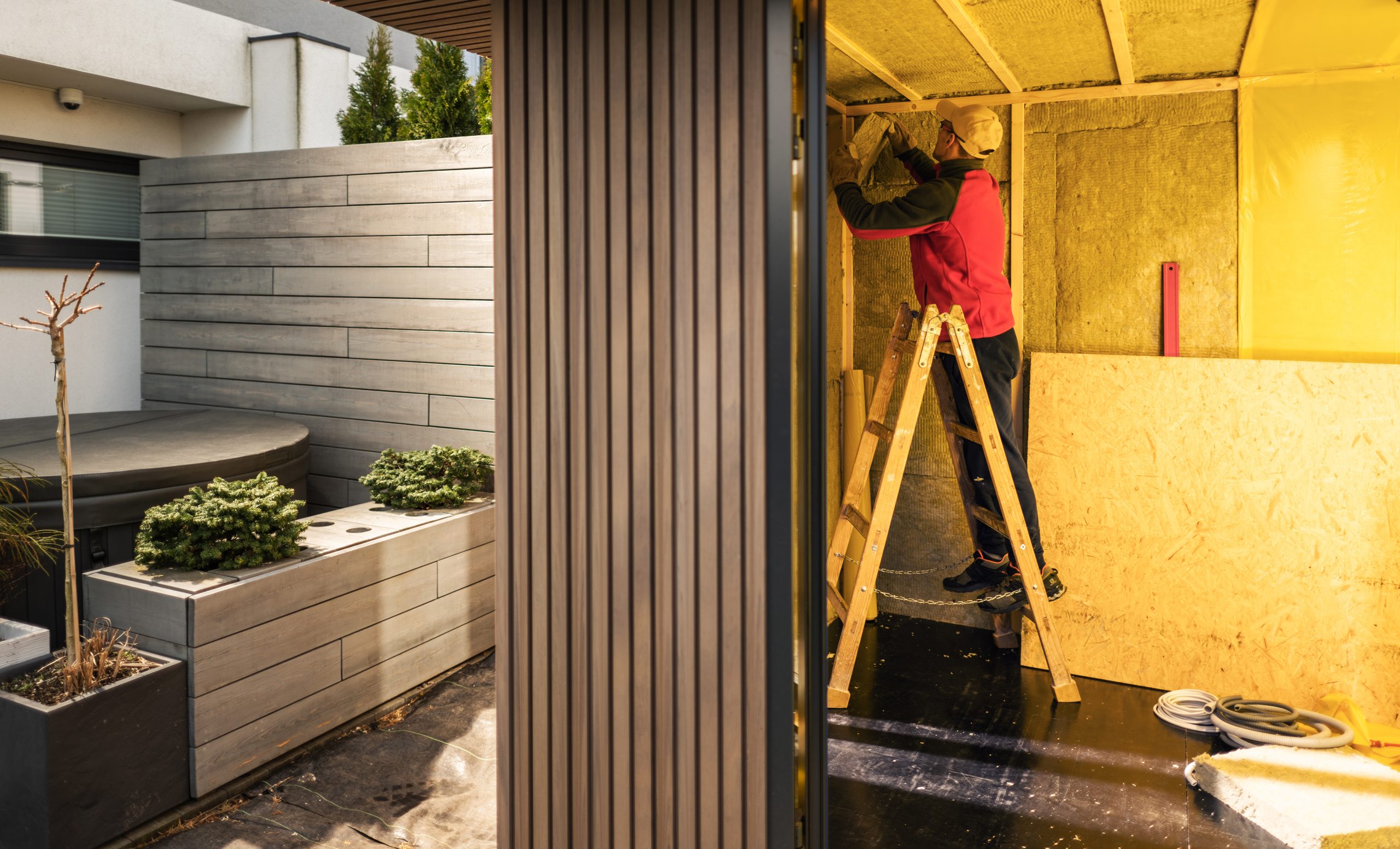 man-insulating-newly-built-garden-shed-with-minera-2023-11-27-05-20-15-utc-scaled man-insulating-newly-built-garden-shed-with-minera-2023-11-27-05-20-15-utc-scaled